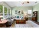 Bright living room with comfortable seating, large windows, and decorative touches at 19207 Autumn Woods Ave, Tampa, FL 33647