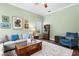 Cozy living room with comfortable seating, a decorative rug, and ample natural light at 19207 Autumn Woods Ave, Tampa, FL 33647