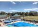 Community pool and splash pad area with covered pool at 19207 Autumn Woods Ave, Tampa, FL 33647