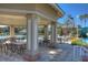 Community pool area featuring a covered seating area with tables and chairs, and lush landscaping at 19207 Autumn Woods Ave, Tampa, FL 33647