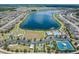 Community aerial showcasing a large lake, playground, tennis, pool and more at 19400 Roseate Dr, Lutz, FL 33558