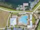 Aerial view of the community pool and dock on the lake at 19400 Roseate Dr, Lutz, FL 33558