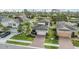 Aerial view of a beautiful home with a well-manicured lawn and a brick driveway at 19400 Roseate Dr, Lutz, FL 33558