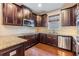 Close up of a beautifully finished kitchen with granite countertops and stylish fixtures at 19400 Roseate Dr, Lutz, FL 33558