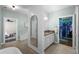 Bright bathroom featuring soaking tub, shower and vanity that leads to a walk-in closet at 2303 S Occident St, Tampa, FL 33629
