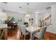 Bright dining room with a piano, elegant chandelier, and wainscoting brings a touch of class to any meal at 2303 S Occident St, Tampa, FL 33629