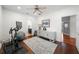 This exercise room includes workout equipment, a woven console table, and access to another room and bath at 2303 S Occident St, Tampa, FL 33629