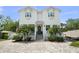 Beautiful two-story home with a lush, landscaped yard and brick paved driveway at 2303 S Occident St, Tampa, FL 33629
