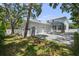 The exterior shows a two-car garage and a paver driveway alongside a two-story home at 2303 S Occident St, Tampa, FL 33629