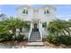 Two-story home with lush landscaping and a brick paved driveway at 2303 S Occident St, Tampa, FL 33629