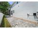 The exterior shows a two-story home with a long paved driveway at 2303 S Occident St, Tampa, FL 33629