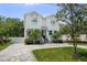 Two-story home showcasing a well-maintained lawn and traditional architecture at 2303 S Occident St, Tampa, FL 33629