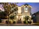 Beautifully lit two-story home with brick driveway, curb appeal, and landscaped exterior at 2303 S Occident St, Tampa, FL 33629