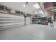 Spacious garage featuring epoxy flooring, storage racks, and ample room for vehicles at 2303 S Occident St, Tampa, FL 33629