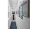Bright hallway with Generac generator and storage leading to a charming interior door at 2303 S Occident St, Tampa, FL 33629