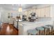 Gourmet kitchen with custom cabinets, stainless appliances, island and breakfast bar is designed for the discerning chef at 2303 S Occident St, Tampa, FL 33629