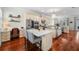 Bright kitchen features an island, stainless steel appliances, a desk, and hardwood floors at 2303 S Occident St, Tampa, FL 33629