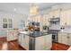 Modern kitchen features stainless appliances, custom cabinets, and a spacious island with a sink for easy food prep at 2303 S Occident St, Tampa, FL 33629
