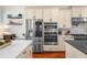 Well-equipped kitchen with stainless appliances, custom cabinets, double oven and hardwood floors, great for cooking at 2303 S Occident St, Tampa, FL 33629