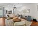Cozy living room with neutral decor, hardwood floors, and a stylish bar area is great for relaxing or entertaining at 2303 S Occident St, Tampa, FL 33629
