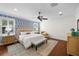 Serene main bedroom featuring hardwood floors, neutral paint, and ample natural light at 2303 S Occident St, Tampa, FL 33629