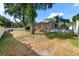 Spacious backyard with mature trees, partial privacy fence and screened in porch with pool at 2402 Blue Stone Ct, Valrico, FL 33594