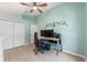 Bedroom with a ceiling fan and large closet, featuring a desk for a home office setup at 2402 Blue Stone Ct, Valrico, FL 33594