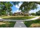 Charming single-story home with a well-maintained lawn, mature trees, and a circular driveway, providing great curb appeal at 2402 Blue Stone Ct, Valrico, FL 33594