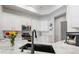 Bright kitchen with white cabinets, stainless steel appliances and modern finishes with view of stainless steel refrigerator at 2402 Blue Stone Ct, Valrico, FL 33594