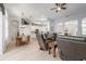 Spacious open-concept living room with hardwood flooring, dining, and kitchen at 2402 Blue Stone Ct, Valrico, FL 33594
