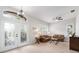 Bright and inviting living room with high ceilings, plantation shutters, and stylish furnishings that add warmth and charm at 2402 Blue Stone Ct, Valrico, FL 33594