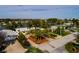 Aerial view of the property in its waterfront neighborhood, showcasing the lush landscaping and proximity to the water at 2487 W Bay Isle Se Dr, St Petersburg, FL 33705