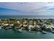 An aerial shot capturing the waterfront home's location, dock, and beautiful seaside neighborhood at 2487 W Bay Isle Se Dr, St Petersburg, FL 33705
