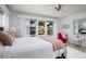 Bright bedroom with comfortable furniture, cozy bedding, and windows offering outdoor views for a peaceful ambiance at 2487 W Bay Isle Se Dr, St Petersburg, FL 33705