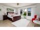 Comfortable bedroom featuring a bed, natural light, and outdoor views creating a relaxing retreat at 2487 W Bay Isle Se Dr, St Petersburg, FL 33705