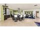 Open-concept kitchen with modern cabinets, a central island with seating, and stainless steel appliances at 2487 W Bay Isle Se Dr, St Petersburg, FL 33705