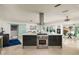 Stylish kitchen with a central island, offering seating and stainless steel appliances for modern living at 2487 W Bay Isle Se Dr, St Petersburg, FL 33705
