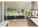 Modern kitchen features sleek cabinetry, stainless steel appliances, and a central island with a cooktop at 2487 W Bay Isle Se Dr, St Petersburg, FL 33705
