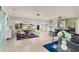 Open-concept living space features modern décor, stylish furnishings, and abundant natural light with water view at 2487 W Bay Isle Se Dr, St Petersburg, FL 33705