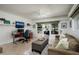 Comfortable living room with desk, media center, plush seating and outdoor access at 2487 W Bay Isle Se Dr, St Petersburg, FL 33705