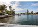Scenic waterfront view of a serene canal lined with lush greenery and charming waterfront homes at 2487 W Bay Isle Se Dr, St Petersburg, FL 33705