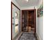 Entryway featuring a stylish wine cellar with glass door, offering a sophisticated storage solution for wine enthusiasts at 2487 W Bay Isle Se Dr, St Petersburg, FL 33705