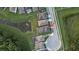 Aerial view of homes with a community pond, highlighting the property's location and neighborhood layout at 2653 Longleaf Pine Pt, New Port Richey, FL 34655