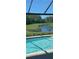 Backyard view with deer near the lake at 2653 Longleaf Pine Pt, New Port Richey, FL 34655