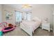Cozy bedroom featuring a twin bed, a white dresser, and natural light perfect for  at 2653 Longleaf Pine Pt, New Port Richey, FL 34655