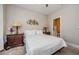 Cozy bedroom featuring a well-lit space with decorative lamps and comfortable bedding at 2653 Longleaf Pine Pt, New Port Richey, FL 34655
