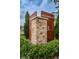 Elegant stone community sign reading 'Residences', framed by manicured shrubbery and tall trees at 2653 Longleaf Pine Pt, New Port Richey, FL 34655