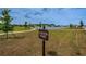 Well-maintained Foster Park features a scenic walking path, lake, and green space at 2653 Longleaf Pine Pt, New Port Richey, FL 34655