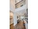 Bright foyer with a soaring ceiling, hardwood floors, and a gallery wall leading to the living spaces at 2653 Longleaf Pine Pt, New Port Richey, FL 34655