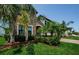Attractive home featuring stone accents, verdant landscaping, and a well-maintained lawn at 2653 Longleaf Pine Pt, New Port Richey, FL 34655
